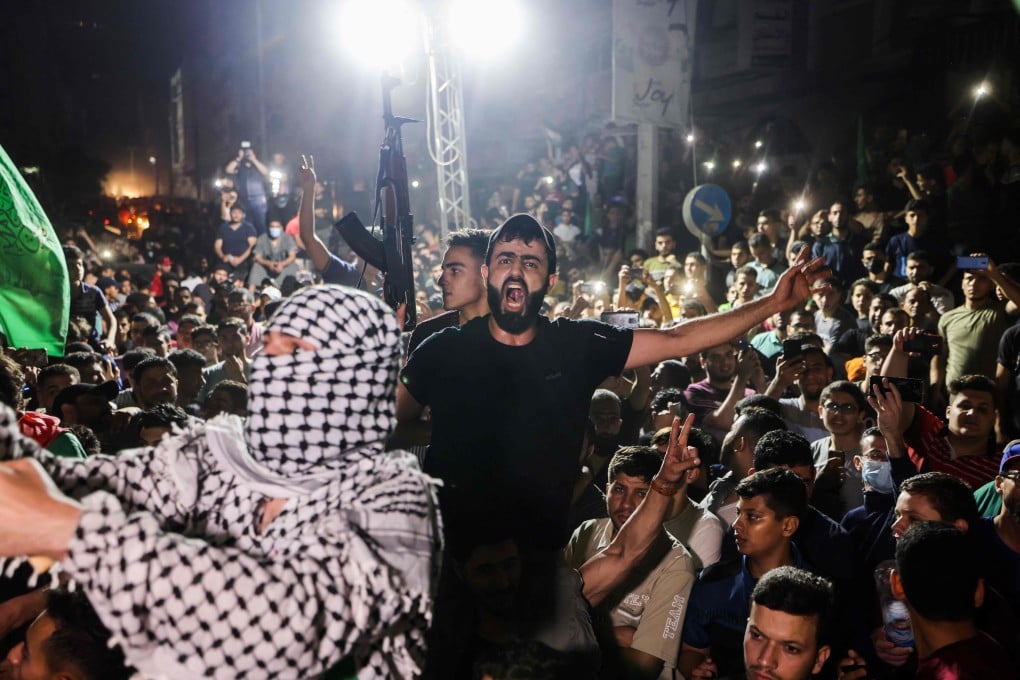 Palestinians celebrate in Gaza City following the ceasefire brokered by Egypt between Israel and Hamas. Photo: AFP