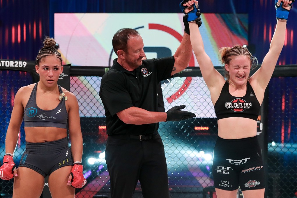 Hannah Guy’s arm is raised after earning a unanimous decision against Valerie Loureda at Bellator 259. Photos: Bellator MMA
