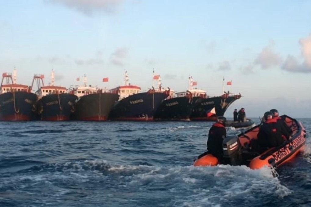 Chinese vessels moored at Whitsun Reef in the South China Sea. File photo: PCG via EPA-EFE