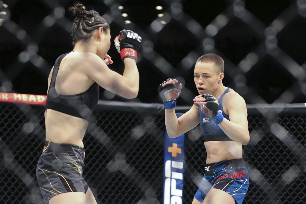 Rose Namajunas (right) and Zhang Weili move around the Octagon during their UFC 261 co-main event. Photo: AP