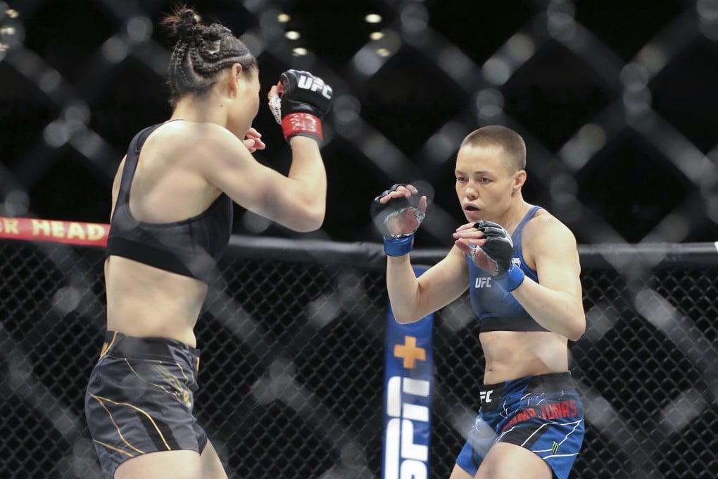 Rose Namajunas (right) and Zhang Weili move around the Octagon during their UFC 261 co-main event. Photo: AP