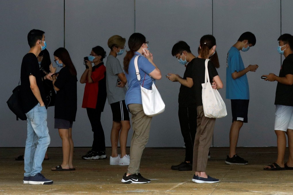 People queue up for swab tests in Singapore on Thursday. Photo: Reuters