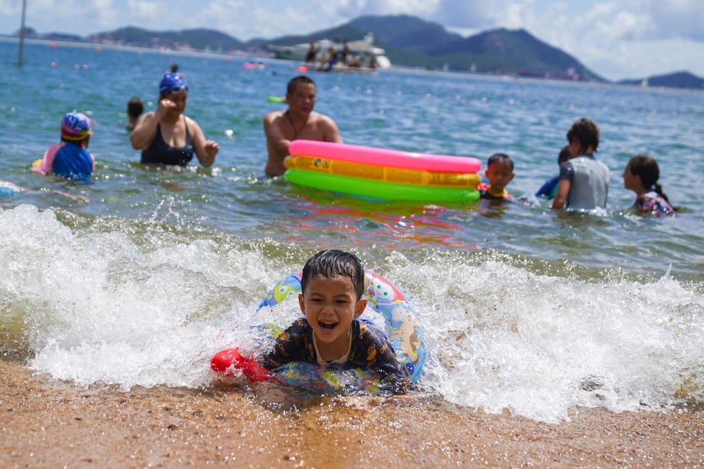 People play in the sea at Repulse Bay on Sunday. Photo: Sam Tsang