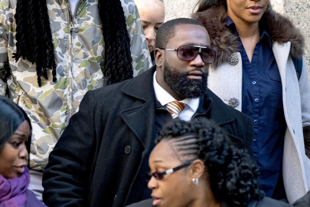Michael Thomas, a former federal prison guard responsible for monitoring Jeffrey Epstein the night he killed himself, leaves court in New York on Friday. Photo: AP