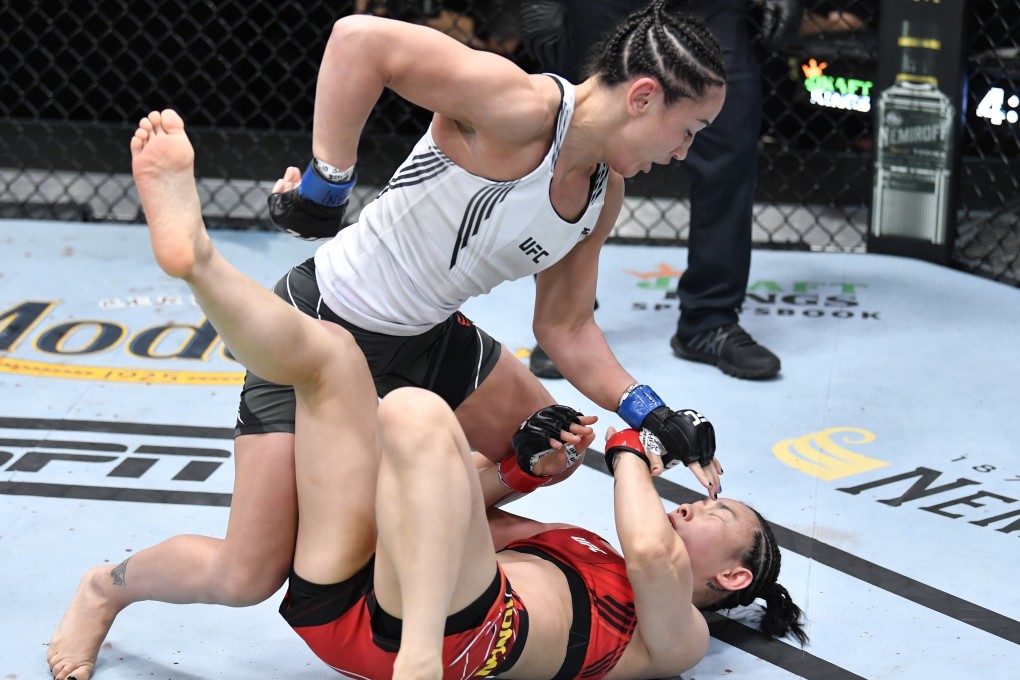 Carla Esparza punches Yan Xiaonan in their women’s strawweight bout at the UFC Apex on May 22, 2021 in Las Vegas, Nevada. Photos: Chris Unger/Zuffa LLC