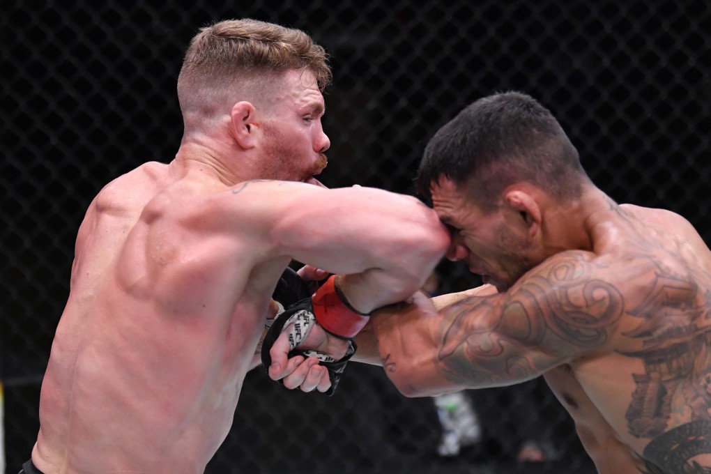 Paul Felder elbows Rafael dos Anjos in their lightweight fight at UFC Vegas 14. Photo: Jeff Bottari/Zuffa LLC