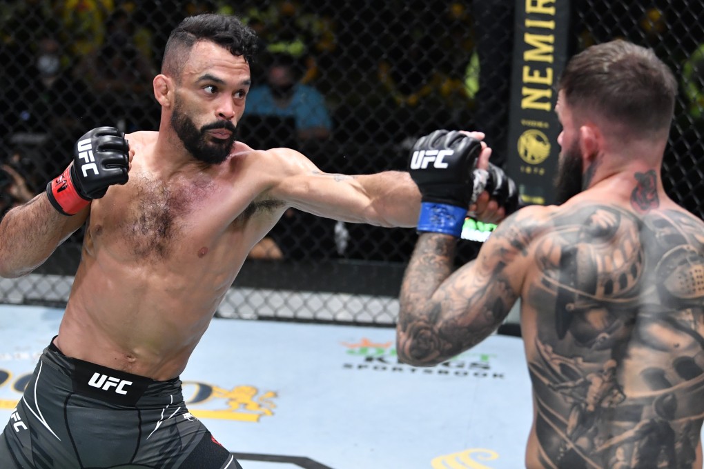 Rob Font punches Cody Garbrandt in their bantamweight bout at UFC Vegas 27. Photos: Chris Unger/Zuffa LLC