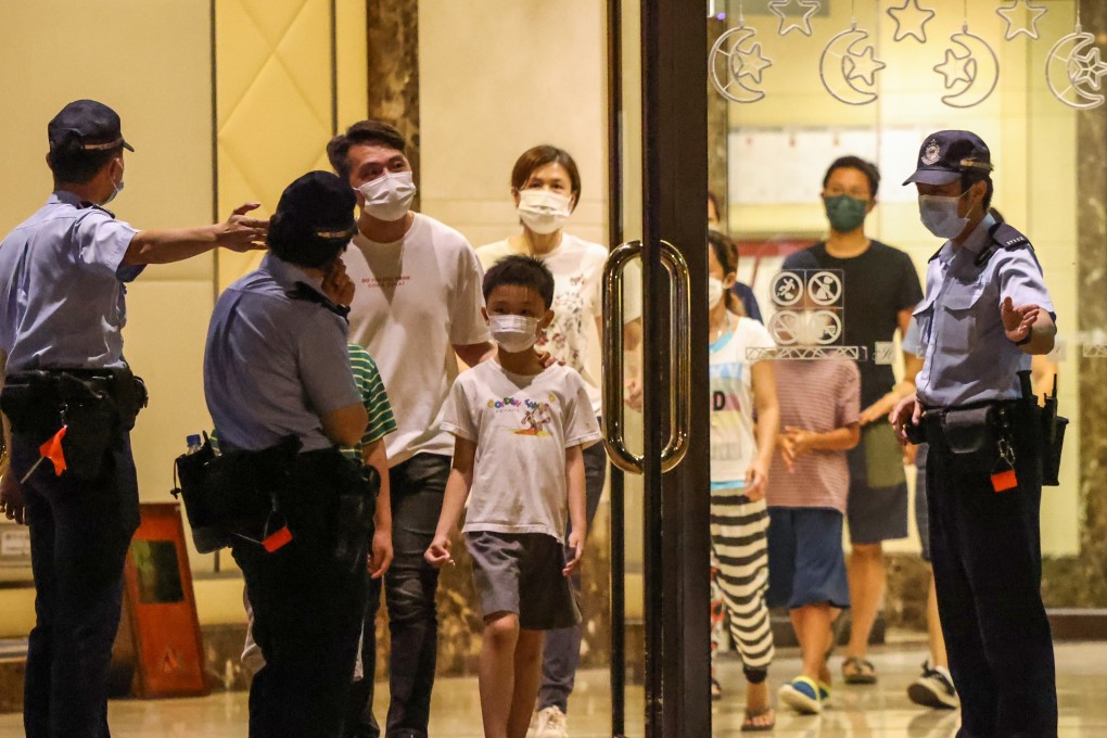 Residents leave Island Harbourview Tower 6 in Tai Kok Tsui. Photo: K. Y. Cheng