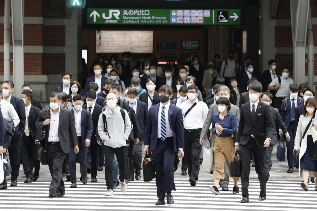 Commuters head out of Tokyo Station on May 6. In Asia, surveys conducted last year showed that most workers missed the social interaction that office life brings. Photo: Kyodo