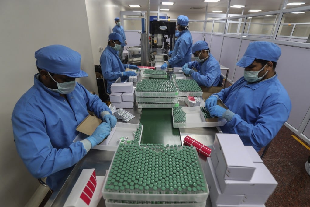 Workers pack boxes containing vials of Covishield, a version of the AstraZeneca vaccine, at the Serum Institute of India in Pune. Photo: AP
