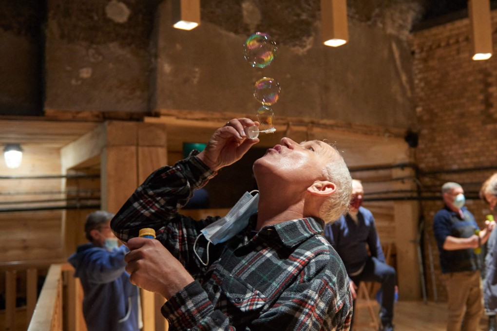 A man blows soap bubbles as part of therapy at the former Wieliczka Salt Mine Health Resort complex located in Wieliczka. Photo: AFP