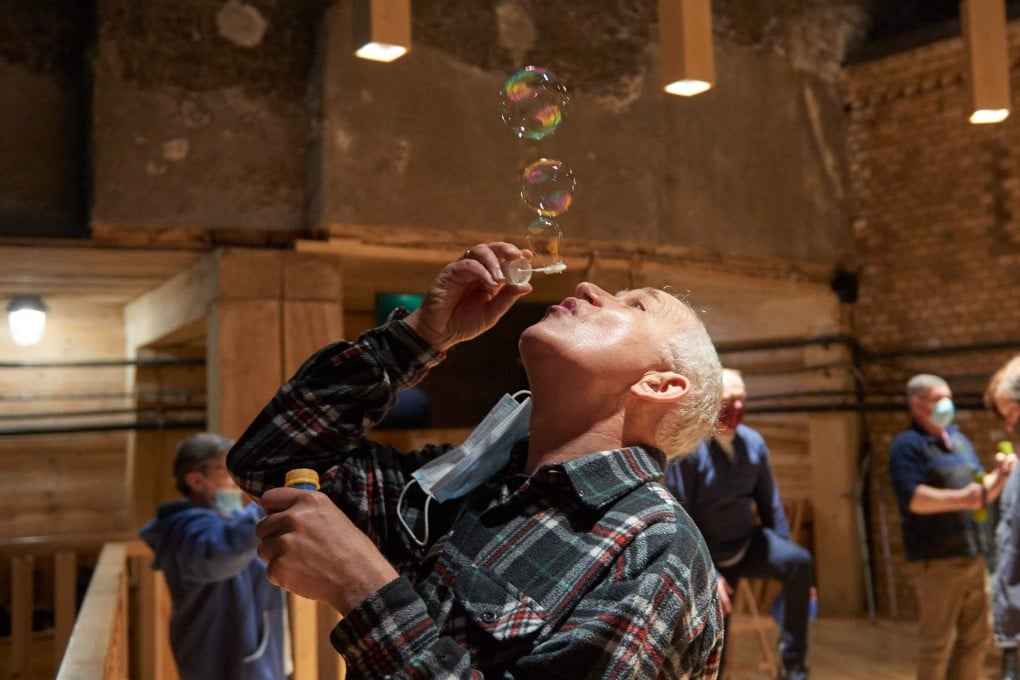 A man blows soap bubbles as part of therapy at the former Wieliczka Salt Mine Health Resort complex located in Wieliczka. Photo: AFP