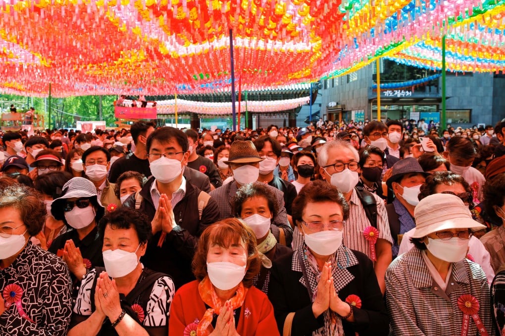 Buddhist believers attend a ceremony celebrating the anniversary of the birth of Buddha in Seoul. Photo: Reuters