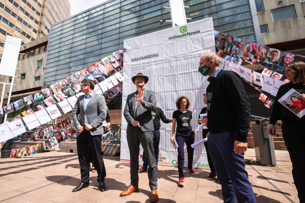 Environmentalists outside the Palace of Justice courthouse in The Hague, Netherlands. Photo: Bloomberg