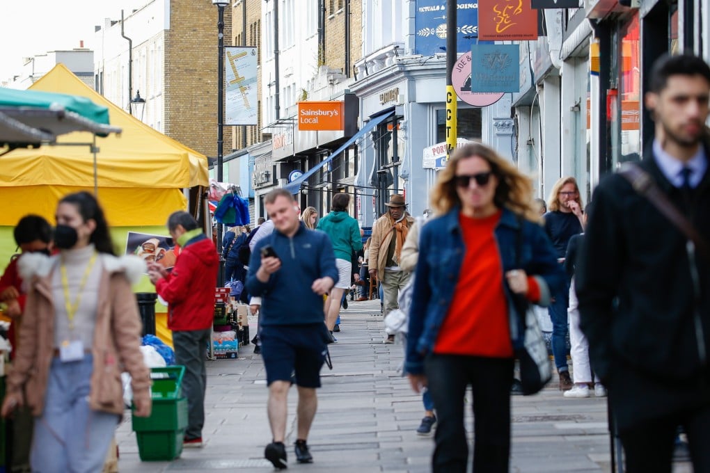 Pedestrians along Portobello Road in the Notting Hill district of London on Wednesday, May 12, 2021. Photo: Bloomberg