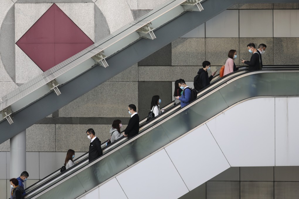 Civil servants at Hong Kong government headquarters, before work-from-home measures took effect amid the Covid-19 pandemic. The city’s civil service has its practices grounded in the British colonial era and they differ markedly from those on the mainland. Photo: Nora Tam