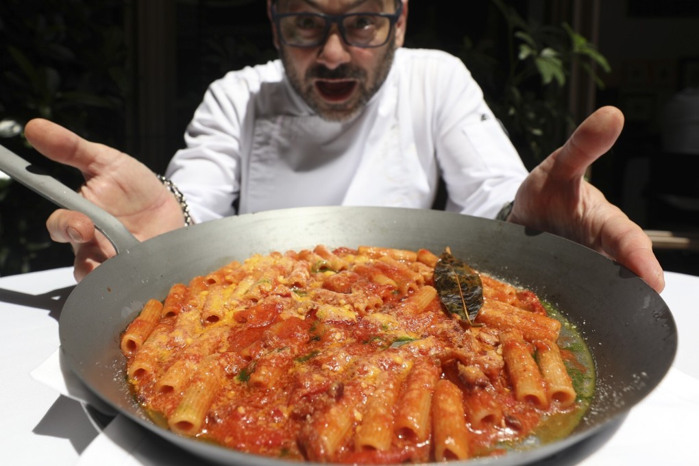 Paolo Monti, chef at Gaia Ristorante in Hong Kong, and his off-the-menu pasta Amatriciana, served in an iron skillet. It is an example of a one-off dish cooked for a regular guest that others then request once word gets out through social media. Photo: Xiaomei Chen