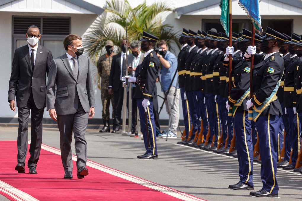 French President Emmanuel Macron (right) inspects the guard of honour in Kigali, Rwanda. Photo: AFP