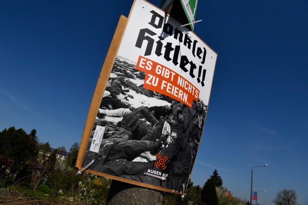 A placard reading “Thanks (to) Hitler! There is nothing to celebrate” and showing a historical photo of World War II dead stands at the outskirts of Goerlitz, in eastern Germany, on April 20, 2018, as hundreds of neo-Nazis prepare to congregate to mark Adolf Hitler’s birthday. Photo: AFP