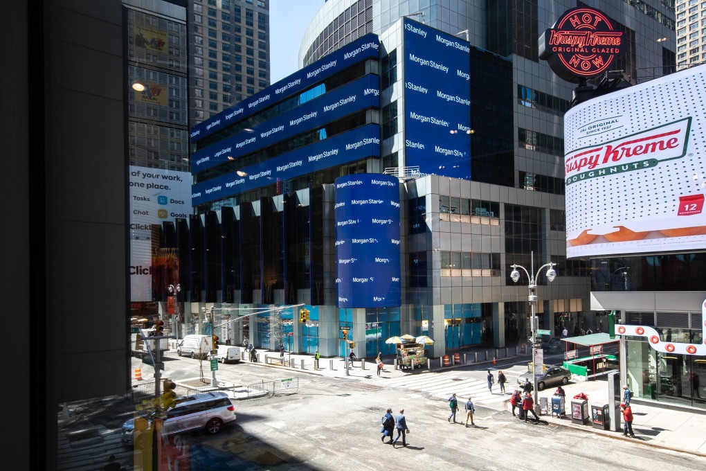 Pedestrians walk past Morgan Stanley’s headquarters in New York. Morgan Stanley is set to buy larger stakes in its securities and mutual funds joint ventures in China. Photo: Bloomberg