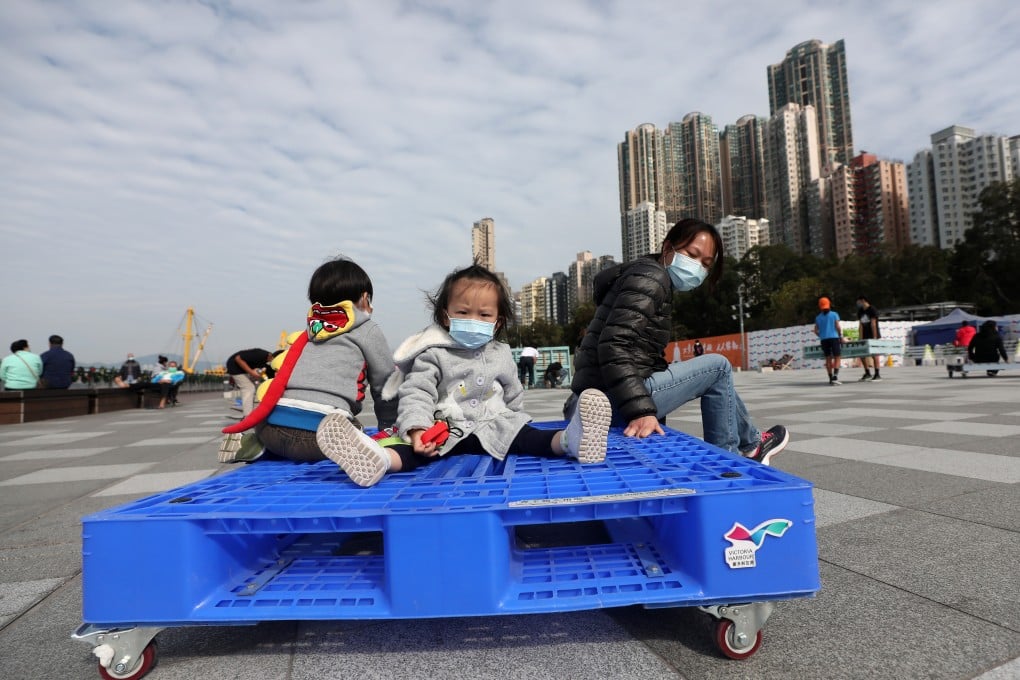 Adults and children enjoy a sunny day at Belcher Bay Promenade in Kennedy Town, Hong Kong. Photo: Xiaomei Chen