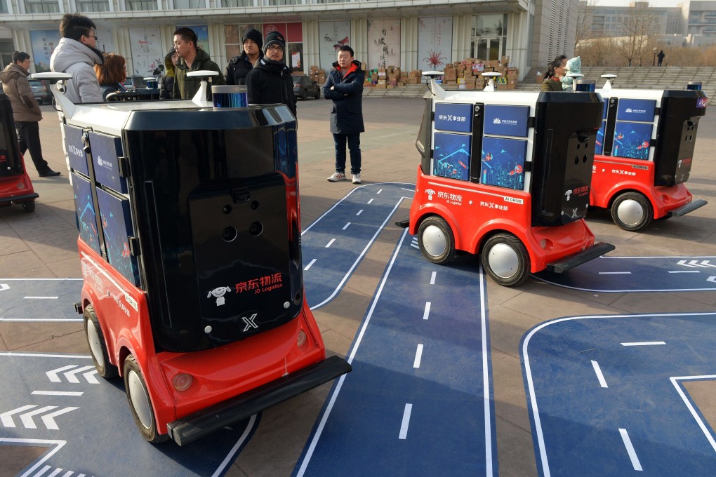 JD.com’s driverless delivery vehicles during a test operation at the Sino-Singapore Tianjin Eco-City in Tianjin on January 18, 2018. Photo: AFP.