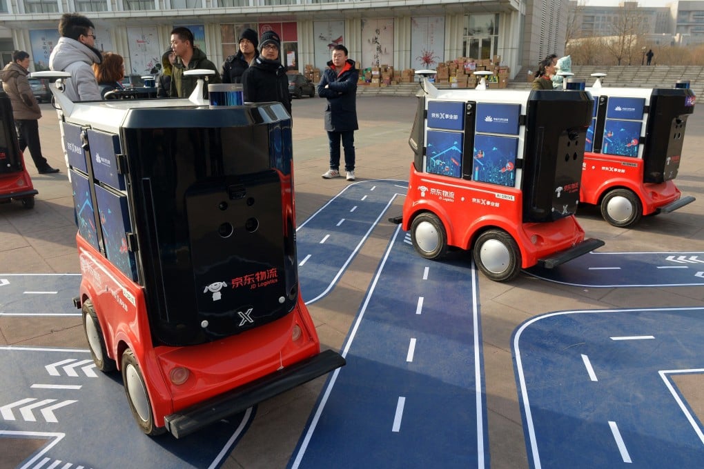 JD.com’s driverless delivery vehicles during a test operation at the Sino-Singapore Tianjin Eco-City in Tianjin on January 18, 2018. Photo: AFP.