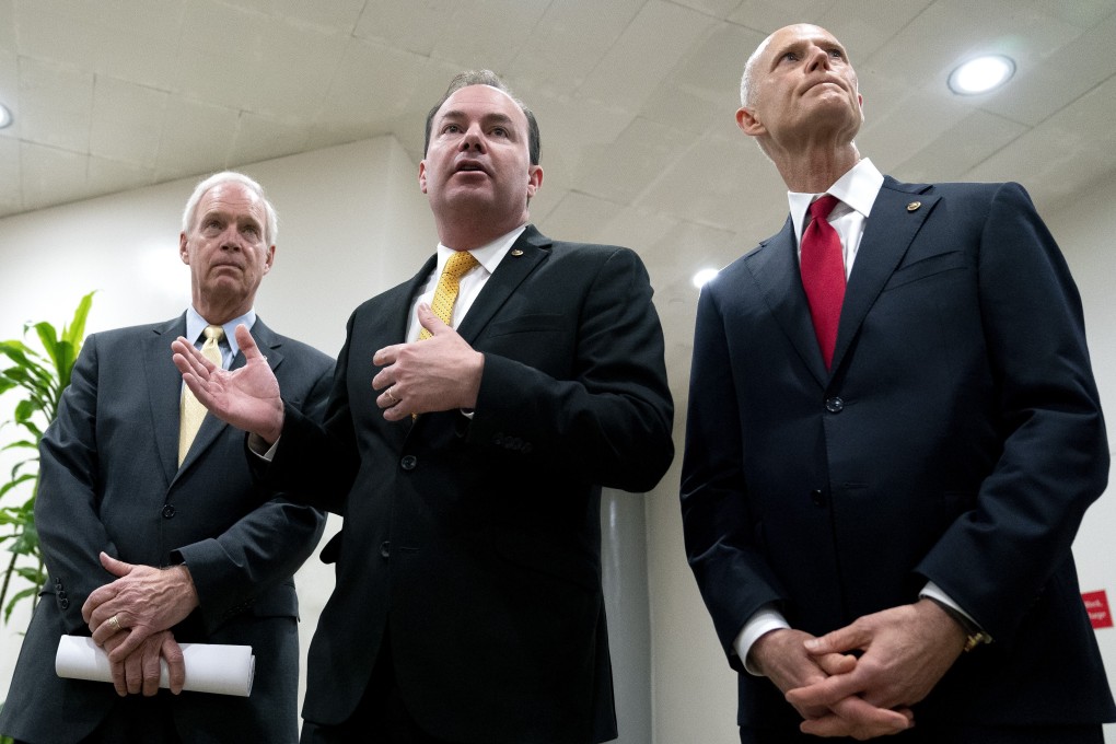 Mike Lee of Utah, flanked by fellow Republican senators Ron Johnson of Wisconsin and Rick Scott of Florida, spoke to reporters on Friday about why they sought a delay in the vote on the Innovation and Competition Act, China-related legislation that has broad bipartisan support. Photo: Bloomberg