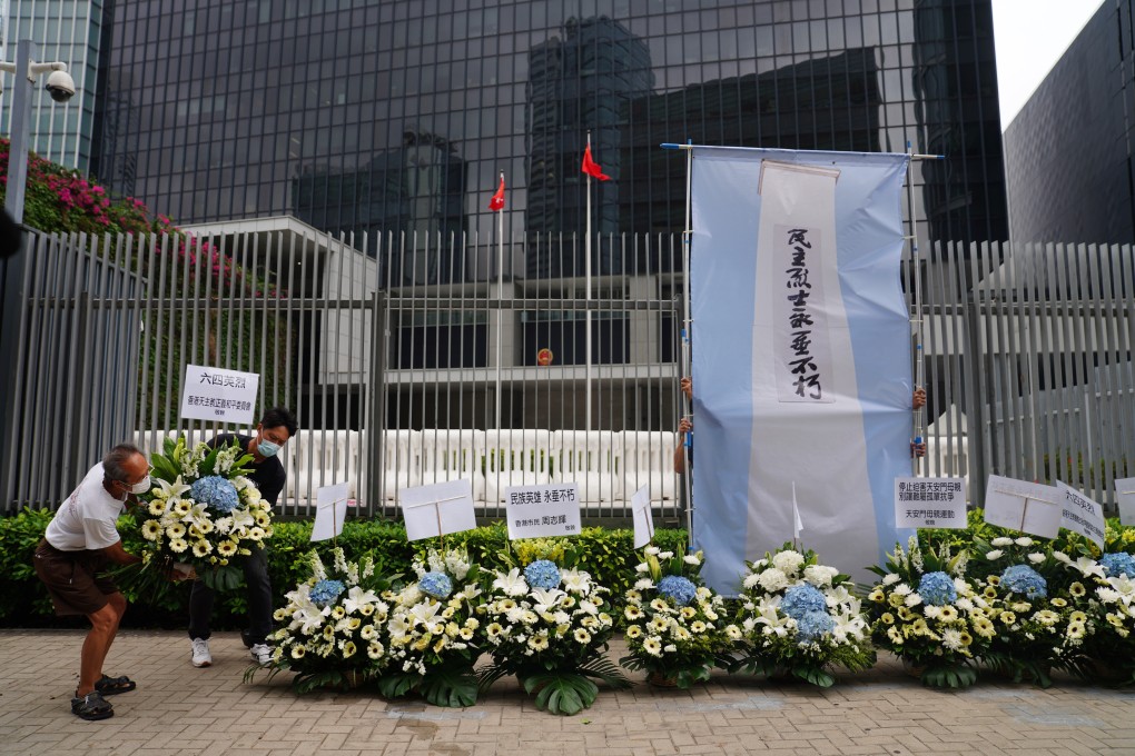 Members of the Hong Kong Alliance in Support of Patriotic Democratic Movements of China lay flowers for a memorial on June 4th outside the Central Government Offices (CGO) at Admiralty. Photo: SCMP / Sam Tsang