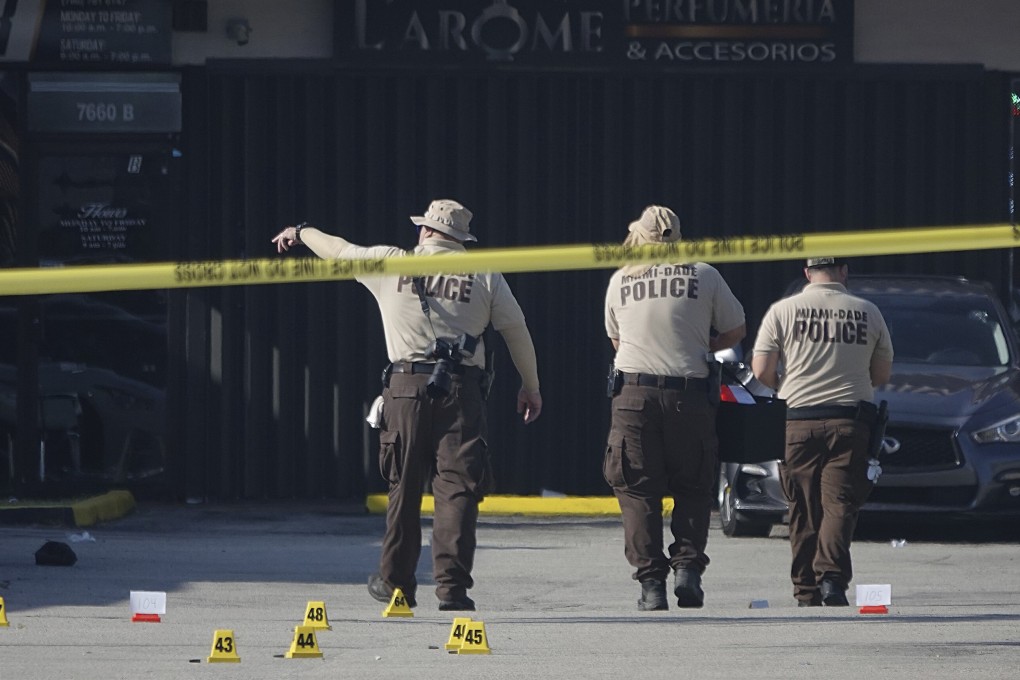 Miami-Dade police work the scene of a shooting outside a banquet hall. Photo: AP