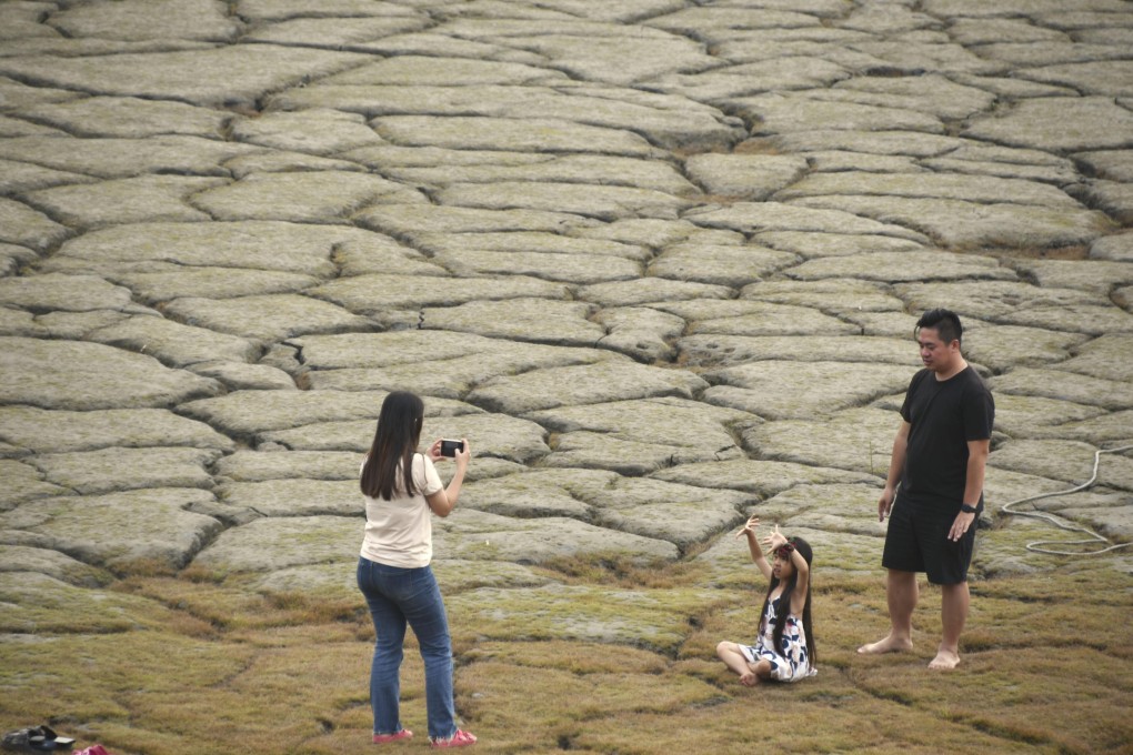 People visit dried up Sun Moon Lake in Taiwan's Nantou County as Taiwan experiences its worst drought in half a century. Photo: Kyodo