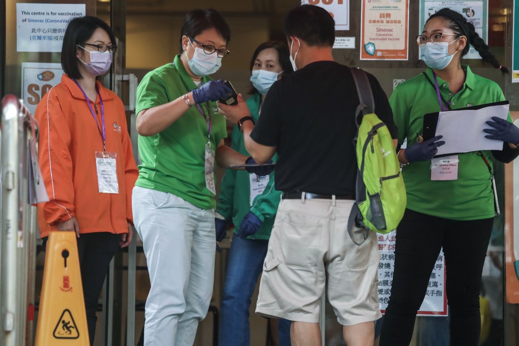A resident arrives for Sinovac vaccination at a community station in Causeway Bay. Photo: Jonathan Wong