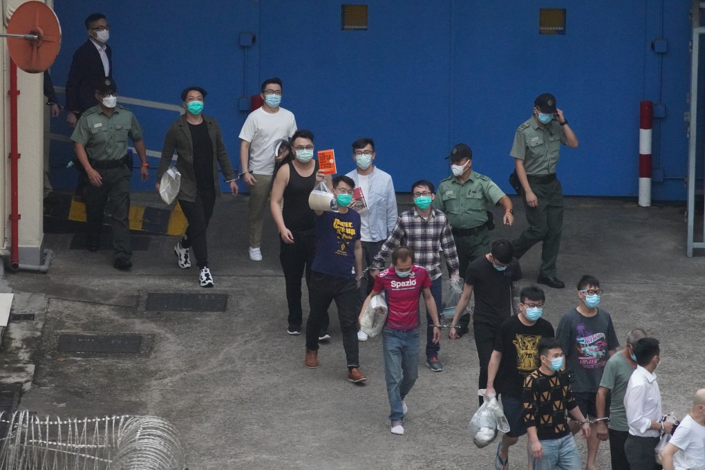 Some of the 47 Hong Kong opposition figures charged with subversion leave the Lai Chi Kok Reception Centre on Monday. Photo: Winson Wong