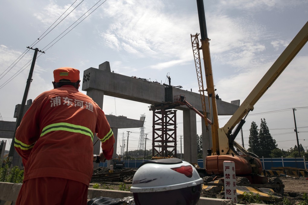 The construction site of an elevated highway on the outskirts of Shanghai. The pilot scheme, currently open to only infrastructure firms, will be expanded to other property sectors after the first Reits prove to be successful. Photo: Bloomberg