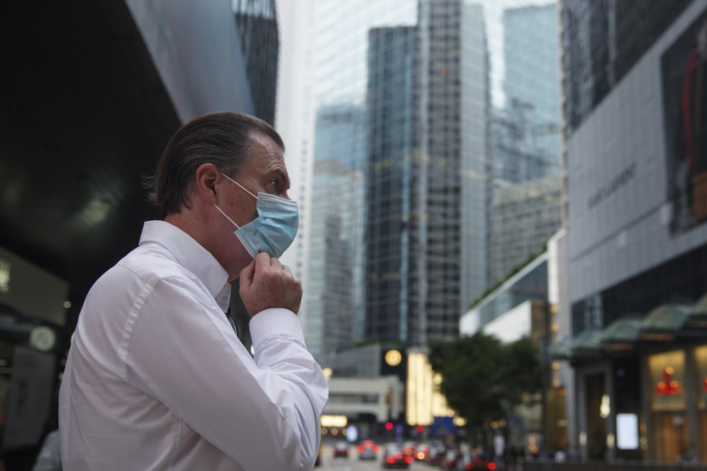 A man walk in Hong Kong’s Central district in October last year. Hong Kong the international city increasingly feels like a thing of the past. Photo: Winson Wong