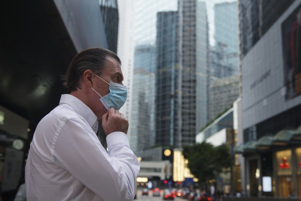 A man walk in Hong Kong’s Central district in October last year. Hong Kong the international city increasingly feels like a thing of the past. Photo: Winson Wong