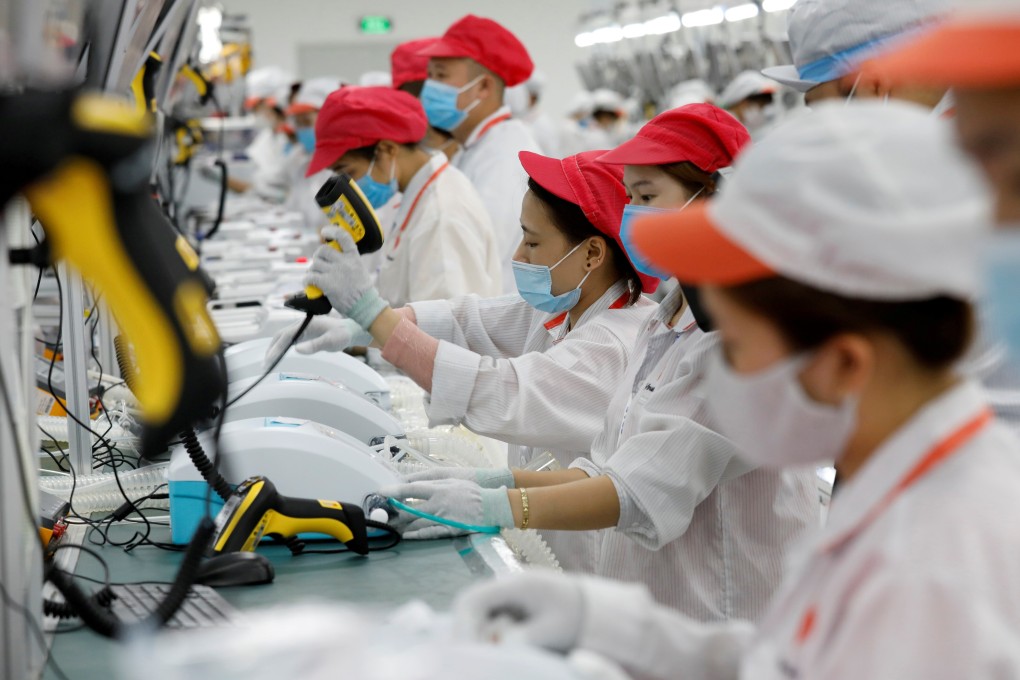 Workers at a factory line in Hanoi. File photo: Reuters