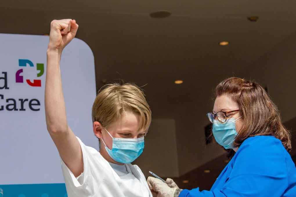 A 13-year-old celebrates being inoculated against Covid-19 at a mass vaccination centre in Hartford, Connecticut, on May 13. The US is allowing children aged 12-15 to receive the Pfizer-BioNTech vaccine. Photo: AFP