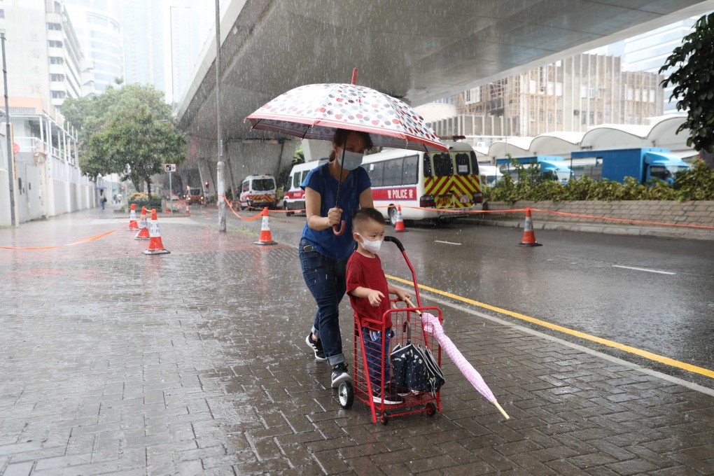 Pedestrians brave the elements on Tuesday. Photo: Winson Wong