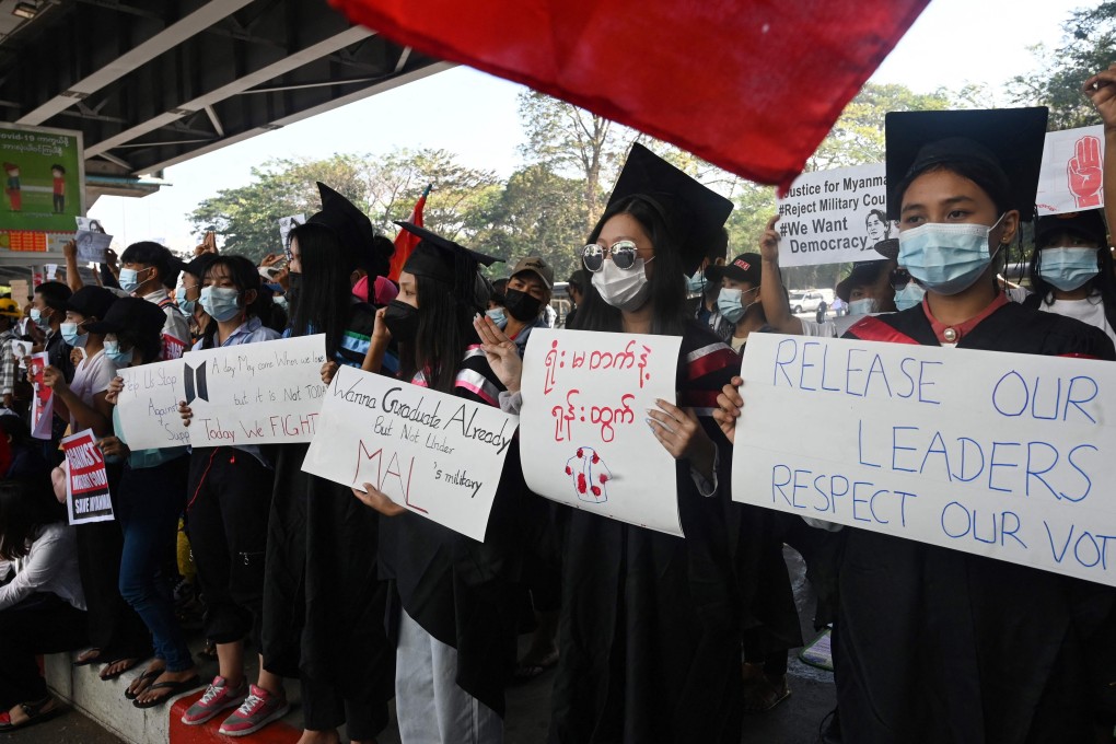 Protesters in school graduation gear take part in a demonstration in Yangon earlier this year against Myanmar’s military coup. Photo: AFP