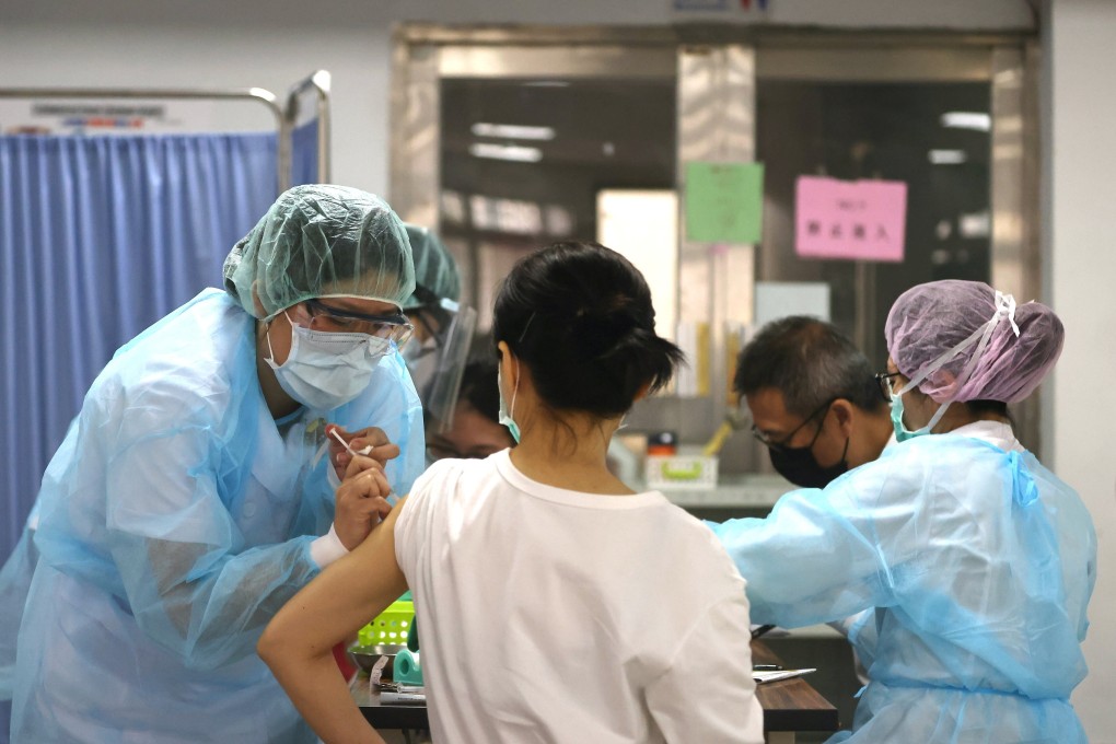 In Taipei, a nurse administers AstraZeneca vaccine during a vaccination session for health care workers amid the rise in Covid-19 infections in Taiwan on Wednesday. Photo: Reuters