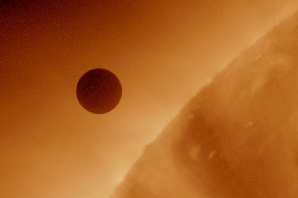 The planet Venus is seen at the start of its transit of the sun in June 2012. Photo: Nasa via Reuters