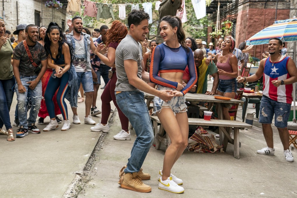 Anthony Ramos (left) and Melissa Barrera in a dance scene from In the Heights, a vibrant, joyous screen musical that is likely to have people dancing in the aisles this summer. Photo: Macall Polay/Warner Bros. Pictures