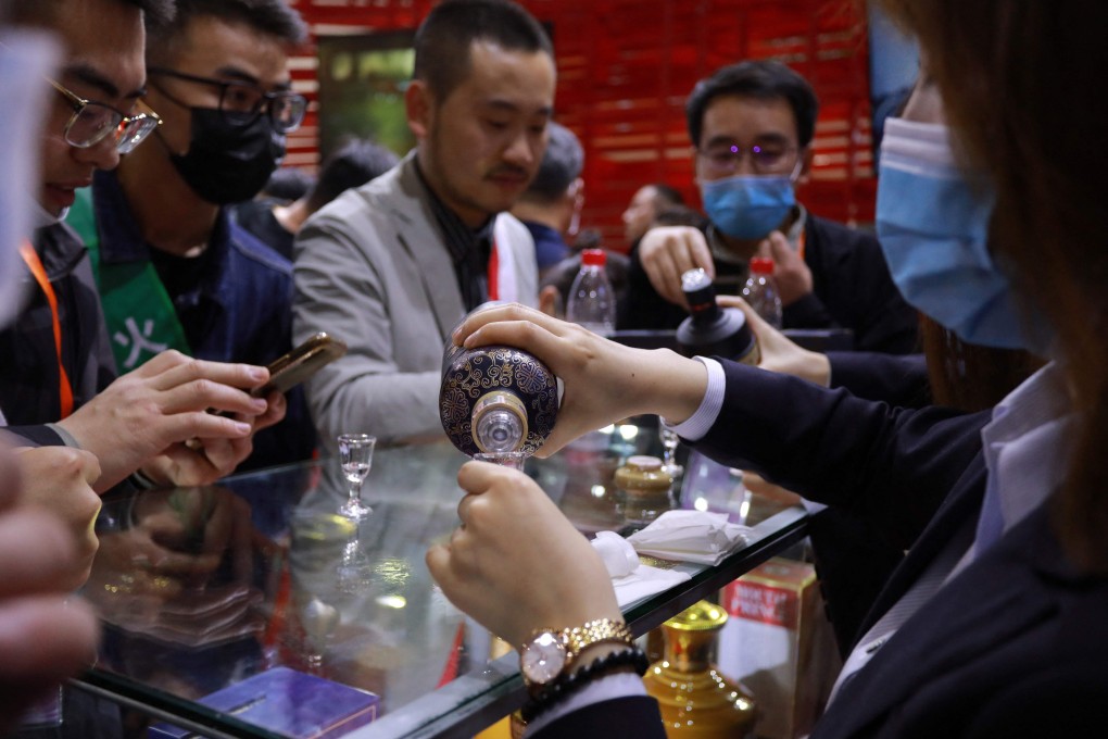 An attendant pours samples of Kweichow Moutai for guests at the China Food and Drinks fair in Chengdu, Sichuan province in April 2021. Photo: AFP