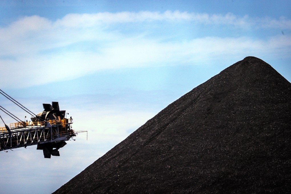 A bucket-wheel reclaimer stands next to a pile of coal at the Newcastle Coal Port in Australia in October 2020. Since the Paris agreement, financial institutions have been providing more money to the coal industry. Photo: Bloomberg
