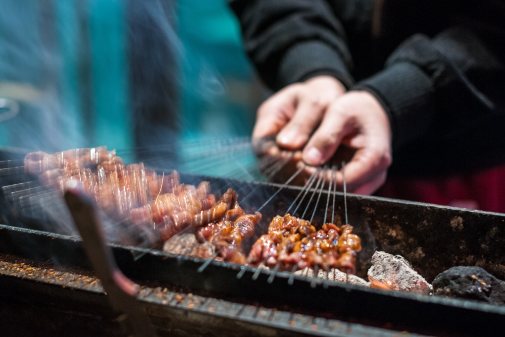 A vendor barbecues beef kebab on metal skewers in Xian, capital of China’s Shaanxi province. Photo: Handout