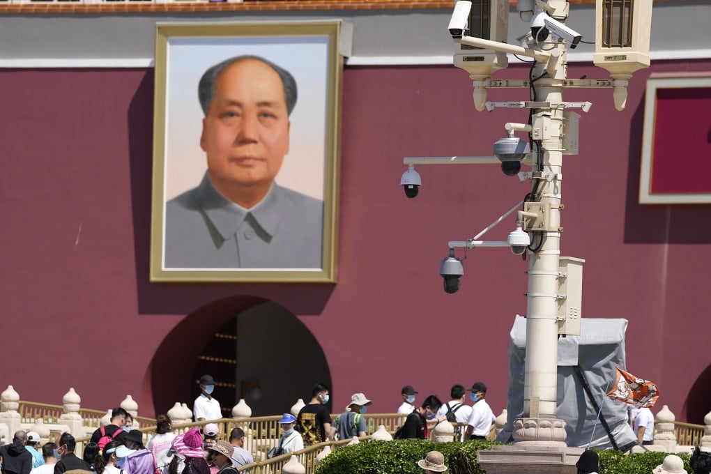 Plainclothes security personnel watch as tourists visit Tiananmen Gate on Friday, June 4, 2021, the 32nd anniversary of a deadly crackdown on pro-democracy protests in Beijing. Commemorations of the June 4, 1989 crackdown on student-led pro-democracy protests were especially muted on Friday amid pandemic restrictions and increasing political repression. Photo: AP Photo