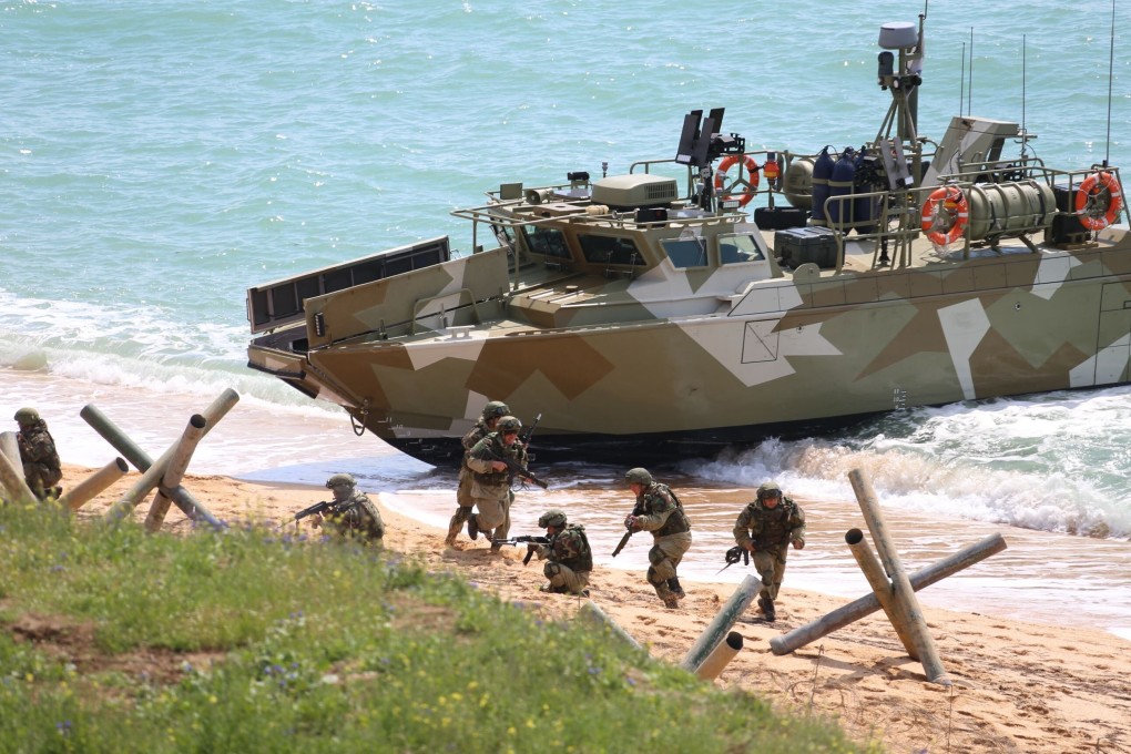 Russian forces land on a shore in the east of the Crimea in April, when the country’s massive military buildup caused Ukrainian and Western concerns. Photo: Russian Defense Ministry Press Service via AP