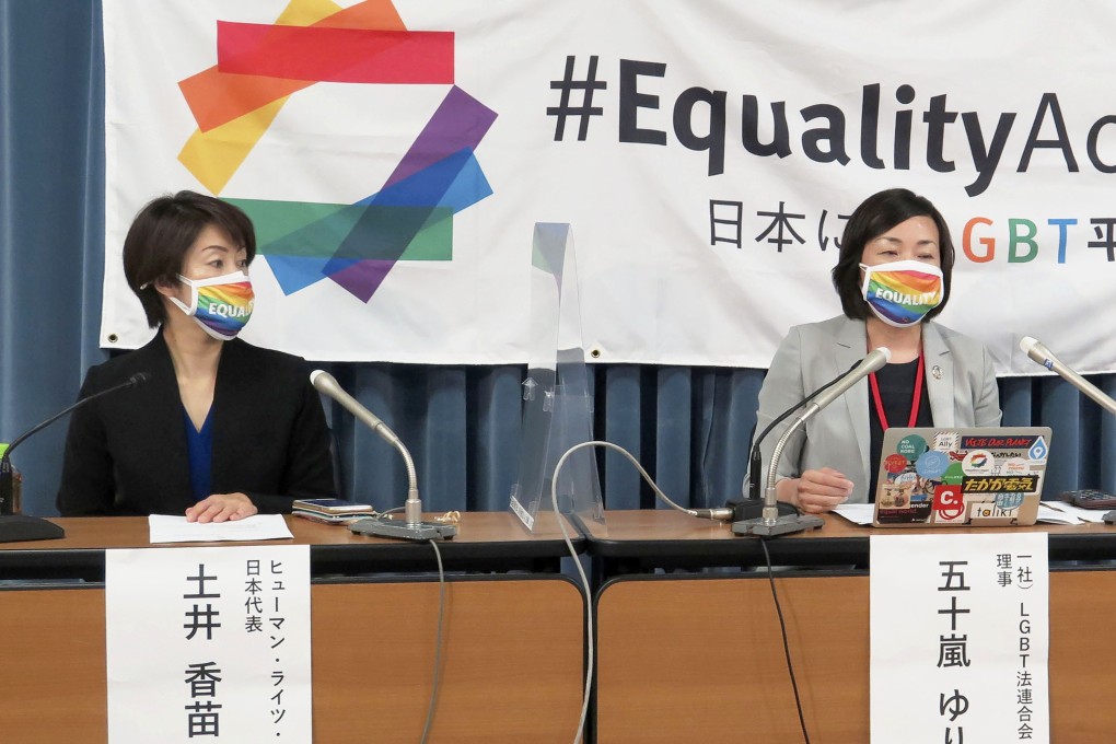 Yuri Igarashi, right, a co-chair of the Japan Alliance for LGBT Legislation, speaks at a press conference in Tokyo on Friday. Photo: Kyodo News via AP