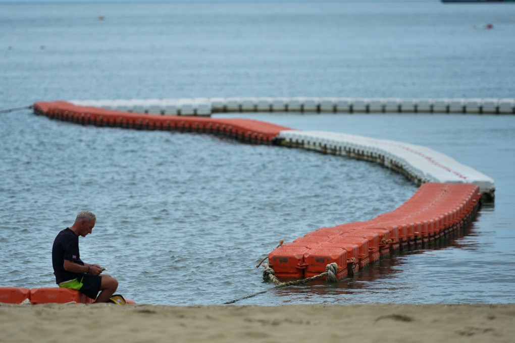 A solitary man sits on the Pattaya beach. Photo: Xinhua